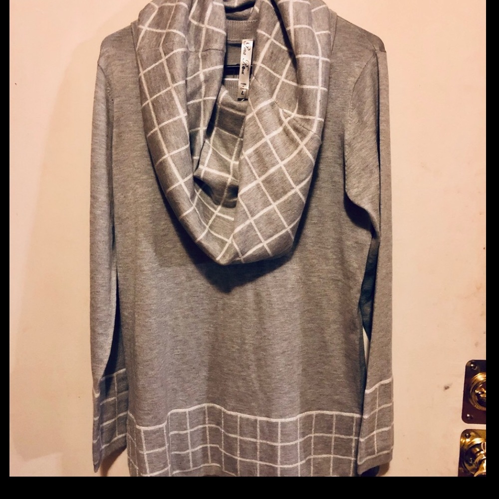 Two piece lady sweater and scarf set.